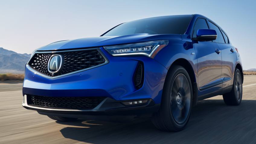 3/4 view of blue RDX on desert road.