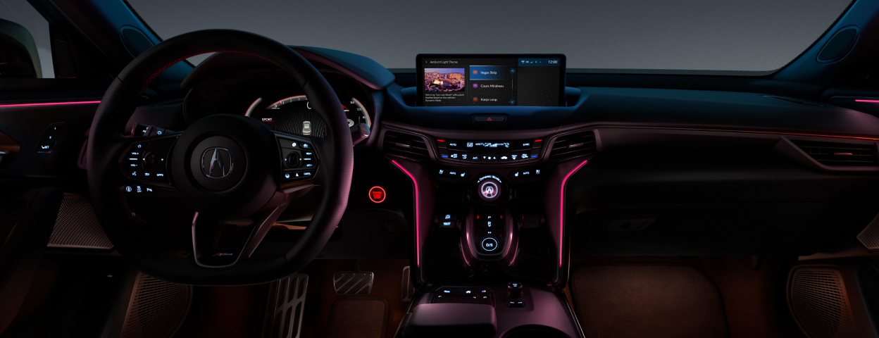 Wide interior view of the cockpit, steering wheel, and dashboard in a TLX.