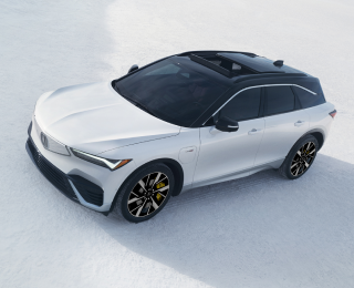 3/4 bird’s eye front view of a white ZDX parked on a salt flat.